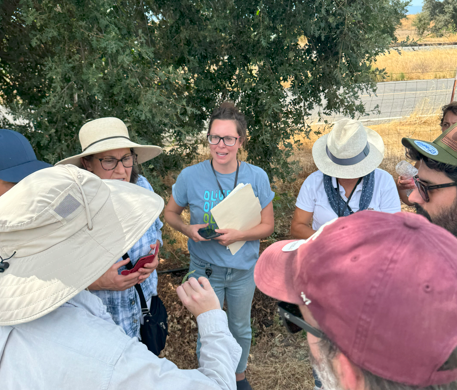 Dr. Boyd highlights a leaf serving as habitat for natural enemies to global industry professionals